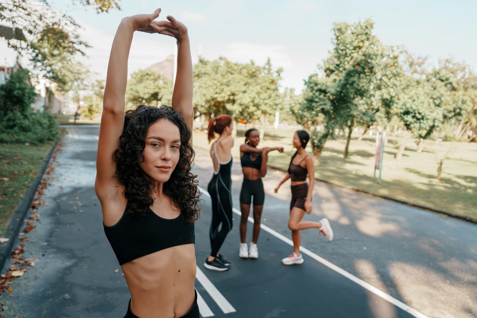 Young woman stretching before a run